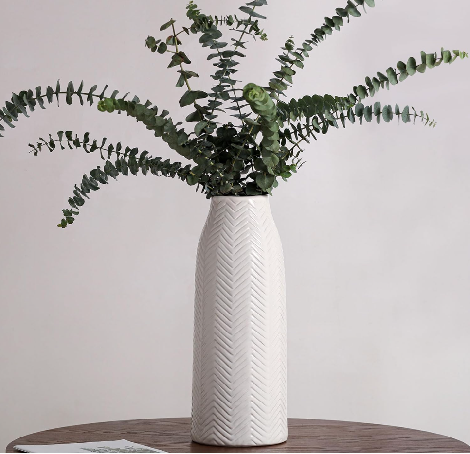 White vase with greenery